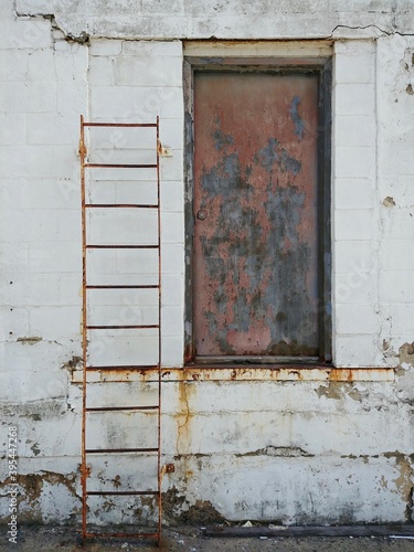 A rusted ladder and door in Hoboken, New Jersey