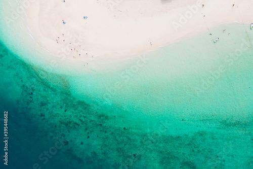 Fototapeta Naklejka Na Ścianę i Meble -  Aerial view of drone. Beaches and shops for food and beverage services on Khai Island, Phuket, Thailand, Seawater clear and blue green. Nature in Khai Island. At Khai island, Phuket, Thailand.
