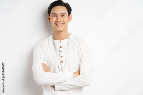 Asian businessman was crossing his arms and smiling confidently