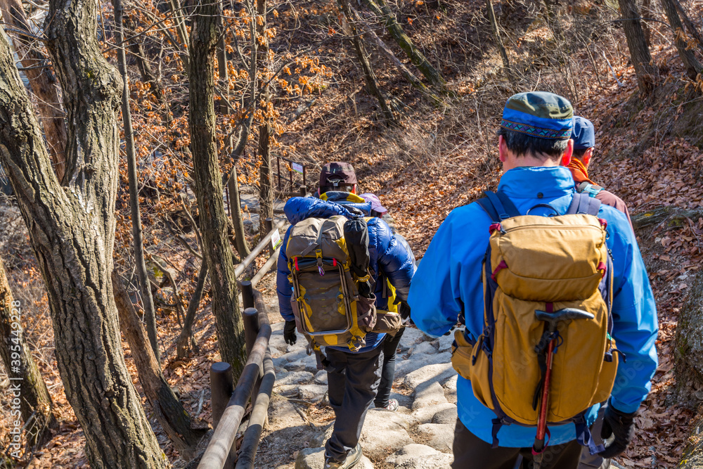 Korean hikers climbing the rock at the Bukhansan Mountain National park in Soeul, South Korea. Korean hikers climbing the rock at the Bukhansan Mountain National park in Soeul, South Korea.