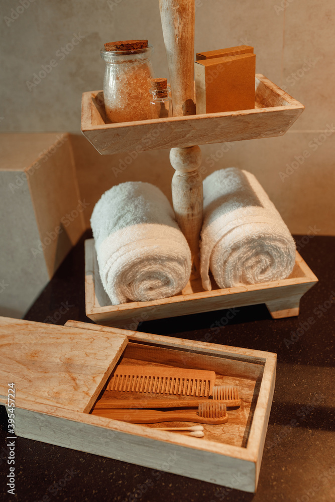 No plastic zero waste concept. Eco friendly wooden bamboo toothbrushes, towel, tooth powder,sea salt,  comb in bathroom