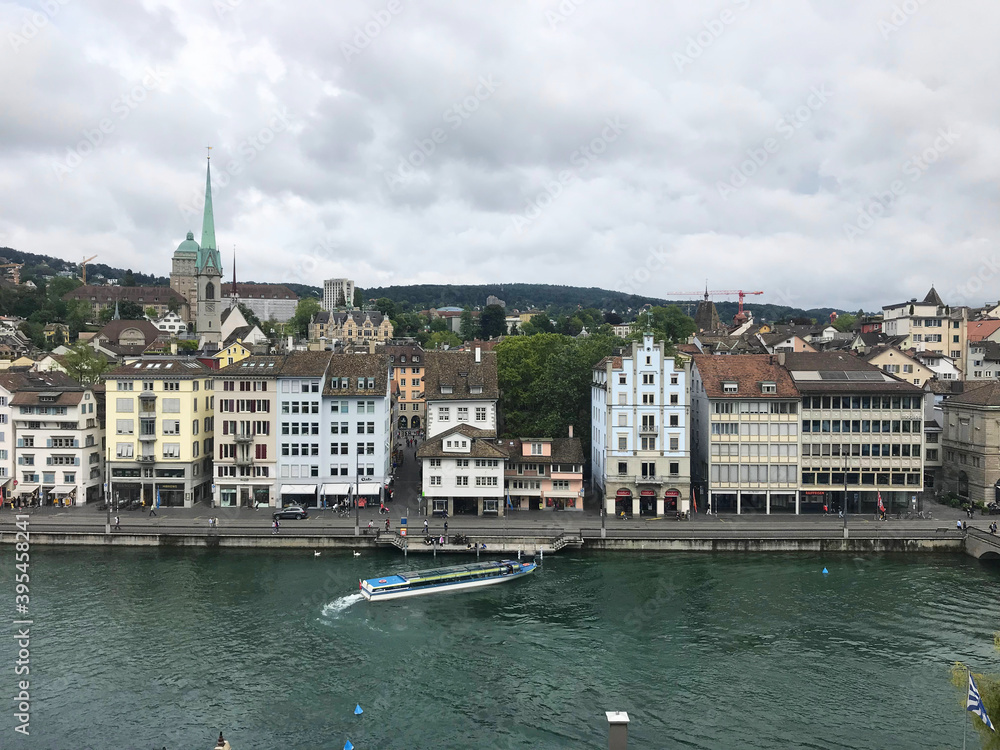 Fototapeta premium lake view near tower of Saint Peter and Fraumünster Church in Zurich, Swiss, Switzerland
