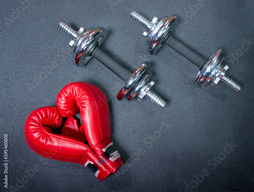 Gym background and fitness equipment and valentine concept. Boxing glove in shape of heart.