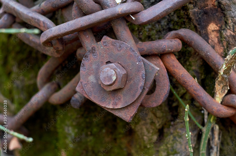 Photo of rusty chain fixed by nut with bolt Photo of rusty chain fixed by nut with bolt