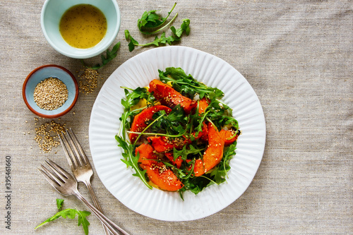 Sesame seed pumpkin with arugula salad