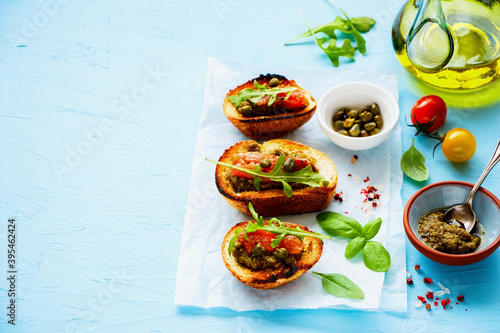 Wallpaper Mural Fresh smoked salmon toasts with arugula, pesto sauce and capers Torontodigital.ca