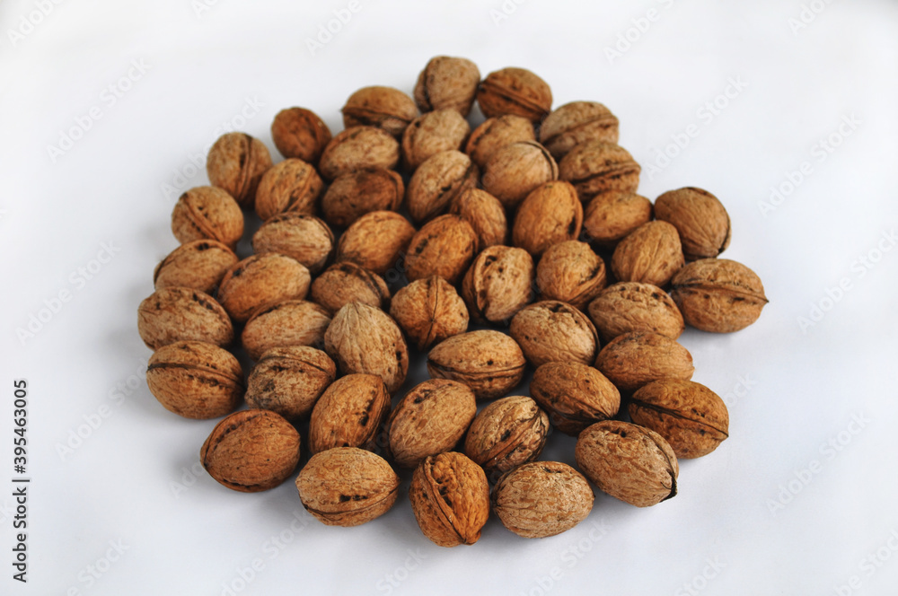 A bunch of walnuts on a white background isolated A bunch of walnuts on a white background isolated