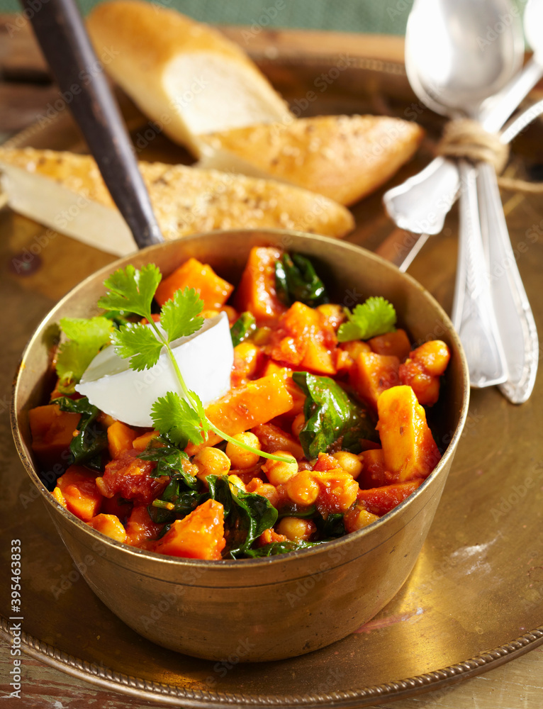 Sweet potato curry with chickpeas, cinnamon, tomato, spinach, garam masala, coriander and natural yoghurt (India) Sweet potato curry with chickpeas, cinnamon, tomato, spinach, garam masala, coriander and natural yoghurt (India)