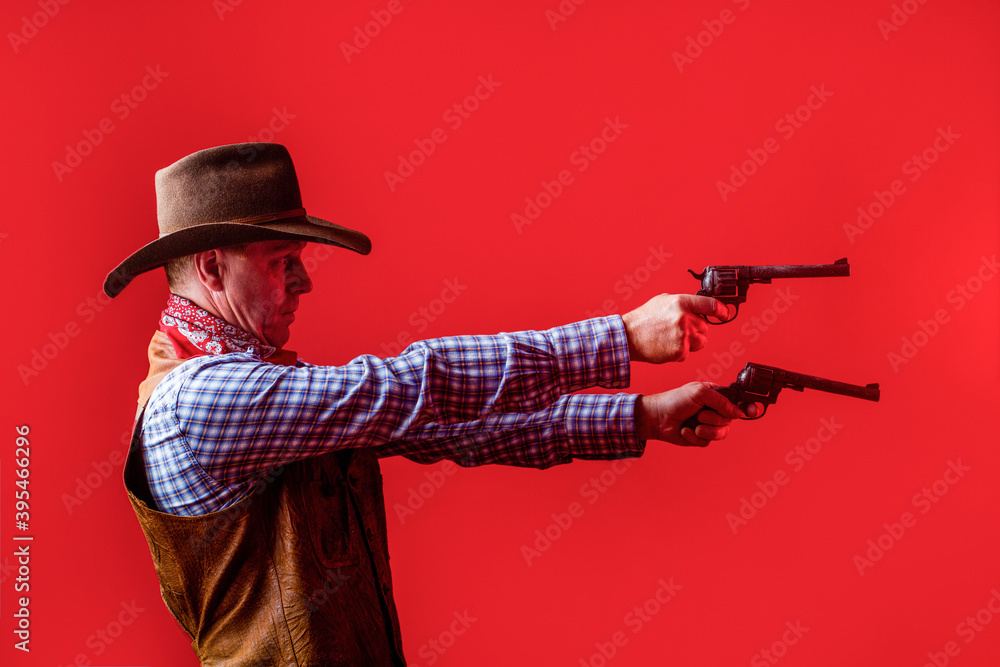 Man wearing cowboy hat, gun. Portrait of a cowboy. West, guns. Portrait of a cowboy. Western man with hat. Portrait of farmer or cowboy in hat. American farmer Man wearing cowboy hat, gun. Portrait of a cowboy. West, guns. Portrait of a cowboy. Western man with hat. Portrait of farmer or cowboy in hat. American farmer