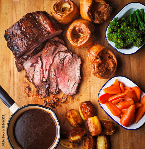 Roast beef with Yorkshire puddings and vegetables (England) photo