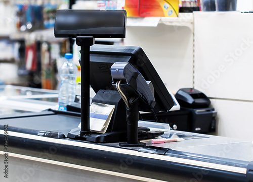 Close-up of cash desk with pos terminal in a mall
