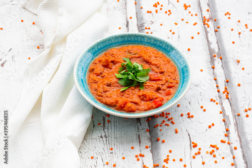 Indian dhal with red lentils garnished with coriander photo