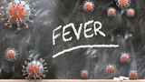 Fever and covid virus - pandemic turmoil and Fever pictured as corona viruses attacking a school blackboard with a written word Fever, 3d illustration