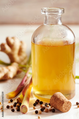 Homemade lemongrass vinegar with ginger, mustard and cilantro photo