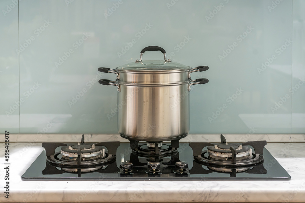 Metal Pot on induction hob in modern kitchen. modern kitchen pot