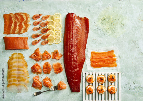 Smoked fish variety - smoked salmon, prawns and haddock and blini