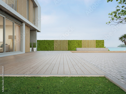 Wallpaper Mural Beach house with wooden terrace near empty cobblestone floor for car park. 3d rendering of green grass lawn in modern sea view home. Torontodigital.ca