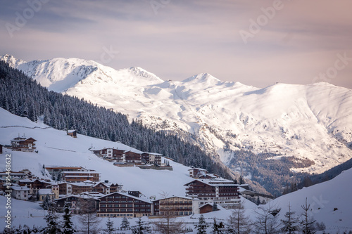 Winter landscape in the Alps. Hotel complex in the ski resort of Mayrhofen in the evening.