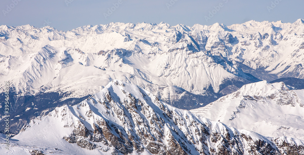 Winter landscape in the Alps. Mayrhofen sports region in the Zillertal. Ski slopes in the background of mountains