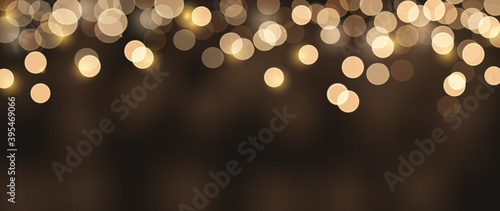 Golden bokeh background wallpaper vector.