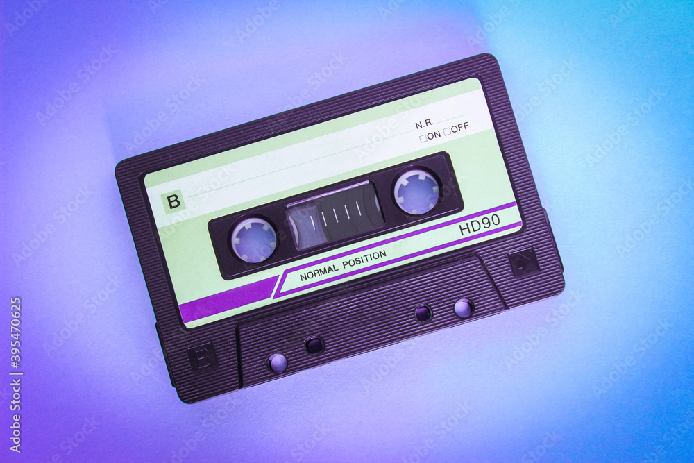 Audio cassette on a colored background close up