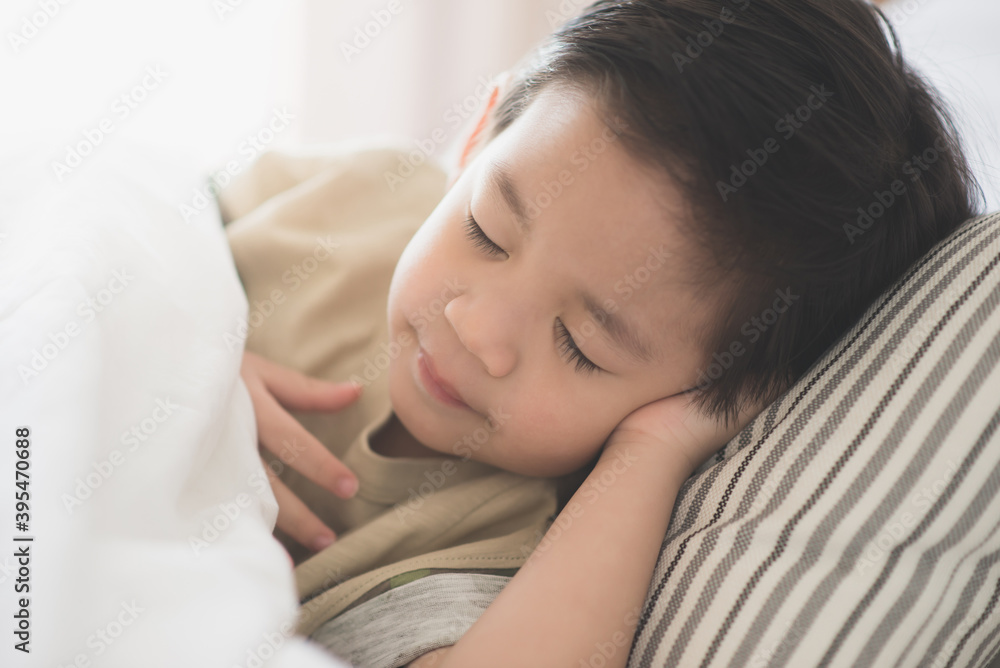 Cute asian child lying