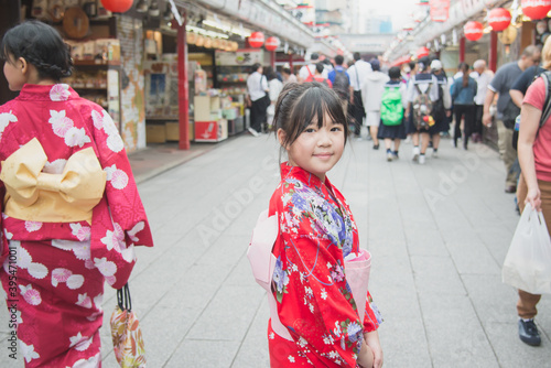 Photography Beautiful Asian girl wearing red kimono  walking in the city,Asakusa Tokyo Japan