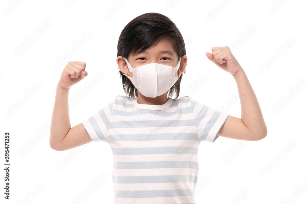 Cute Asian child with protection maskshowing winner sign on white background isolated Cute Asian child with protection maskshowing winner sign on white background isolated