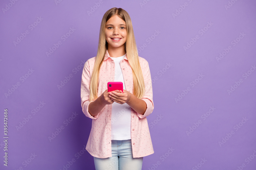 Photo of cool long hairdo pretty girl hold telephone wear pink shirt isolated on violet color background Photo of cool long hairdo pretty girl hold telephone wear pink shirt isolated on violet color background