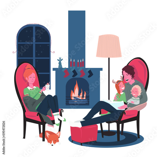 Merry Christmas, Happy New Year! Family time at home. Parents and children sit in armchairs by the Christmas fireplace, dad reads a fairy tale to the children, mom drinks hot chocolate.