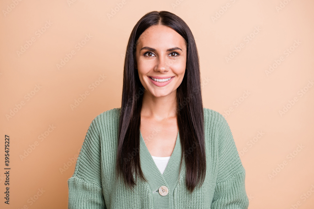 Fototapeta premium Portrait of nice optimistic girl wear green sweater isolated on peach color background