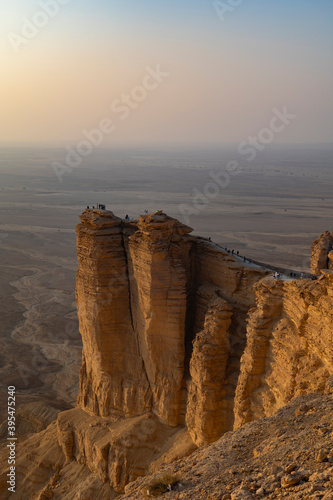 Tourists gather at Edge of the World escarpment near Riyadh, Saudi Arabia photo