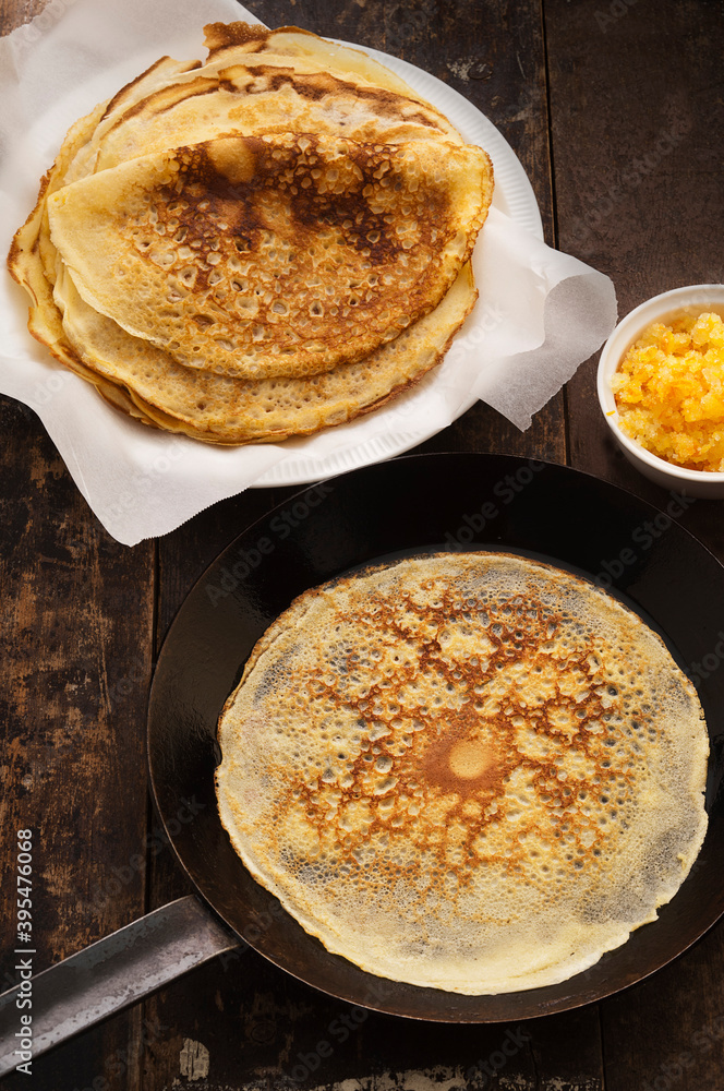 Crepes with lemon and sugar in pan Crepes with lemon and sugar in pan