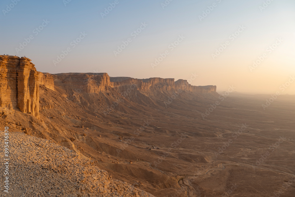 Fototapeta premium Tourists gather at Edge of the World escarpment near Riyadh, Saudi Arabia