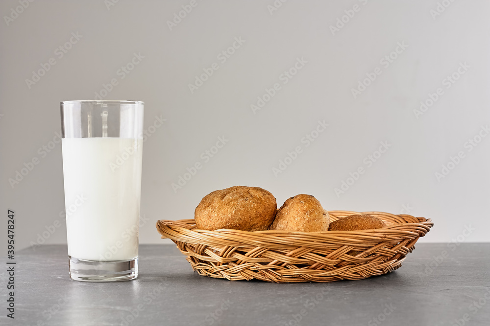 Fresh milk and bread on gray stone table. Kinfolk style. Kefir, vegan milk or Turkish Ayran drink in a glass. World milk day concept. Space for text Fresh milk and bread on gray stone table. Kinfolk style. Kefir, vegan milk or Turkish Ayran drink in a glass. World milk day concept. Space for text