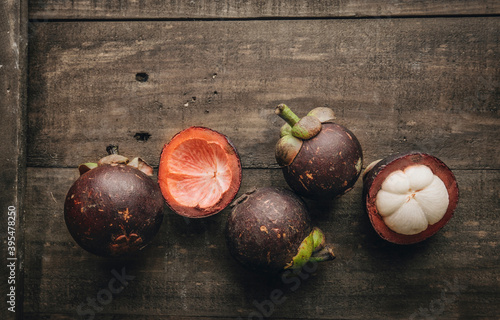 Mangosteens, whole and sliced photo