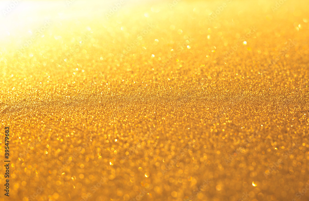 Golden sparkling festive background. Abstract Christmas for card or invitation.