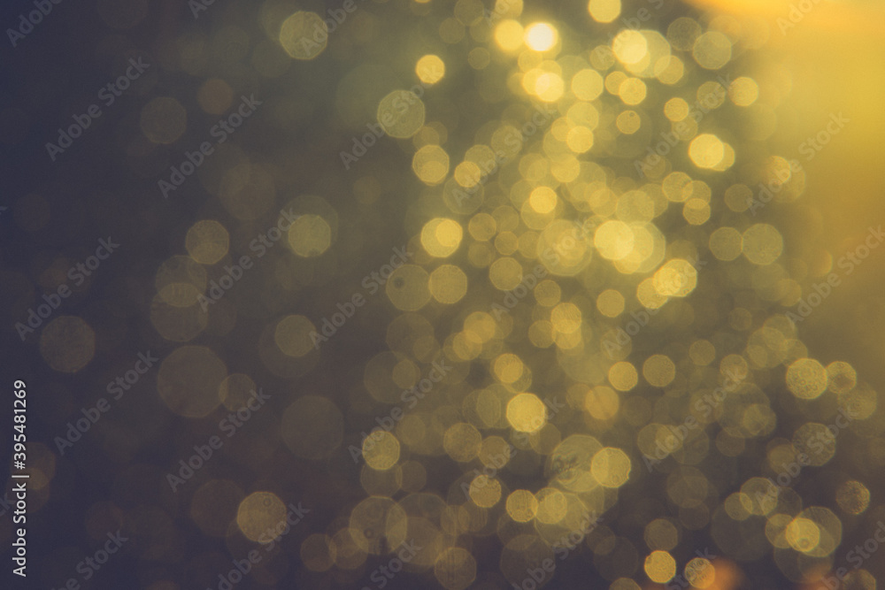 Obraz premium Gold bokeh blur defocus in black backgeound