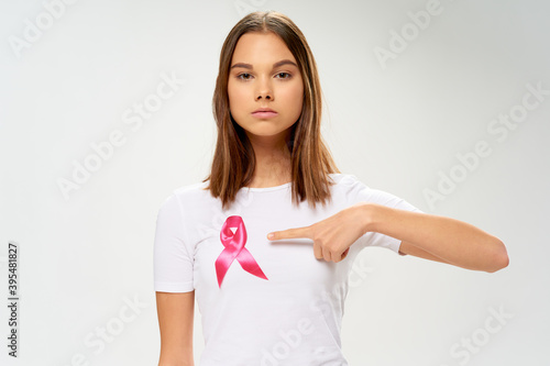 woman in a white t-shirt Ribbon charity foundation care and treatment Copy Space 
