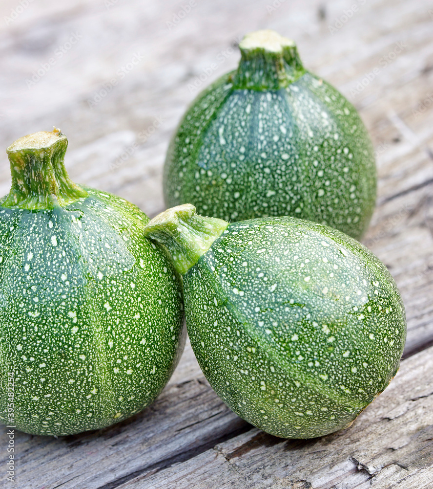 Round zucchini on a wooden background Round zucchini on a wooden background