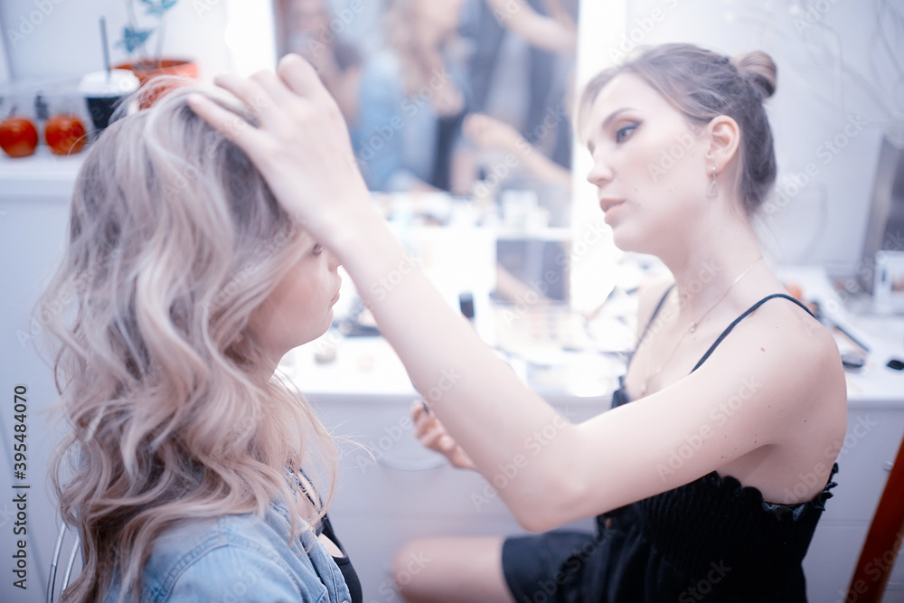 professional make-up in the beauty salon / master makes a professional fresh summer make-up of a beautiful model in the salon professional make-up in the beauty salon / master makes a professional fresh summer make-up of a beautiful model in the salon