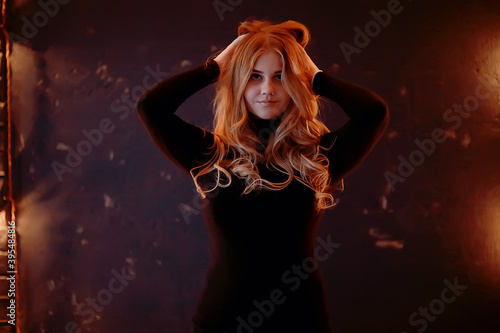 blonde long hair portrait / sexy model posing with long hair, beautiful girl in the studio