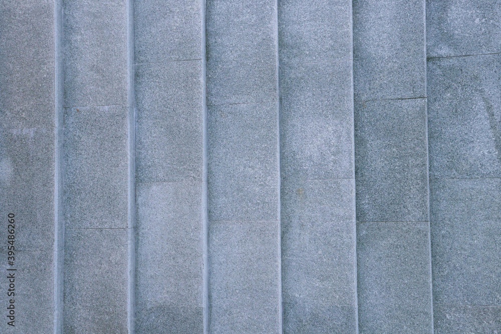 Fototapeta premium Top view of light blue gravel stairs. background texture