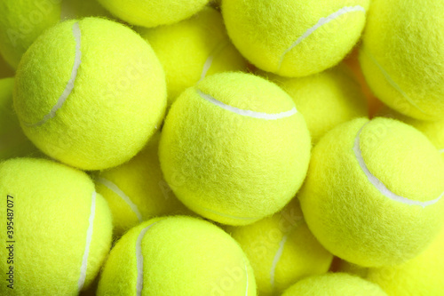 Tennis balls as background, top view. Sports equipment © New Africa