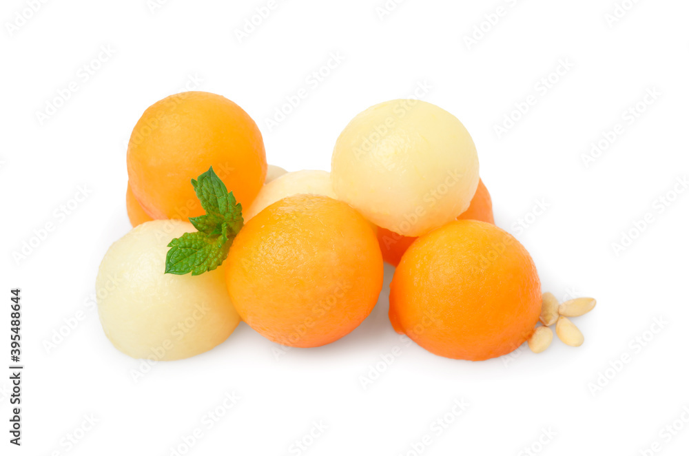 Different melon balls with mint on white background Different melon balls with mint on white background