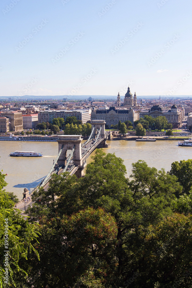 The Szechenyi Chain Bridge, River Danube and church St. Stephen's Basilica in Budapest, Hungary. Panoramic view from the famous Fisherman's Bastion on the Pest side. Hungarian landmarks