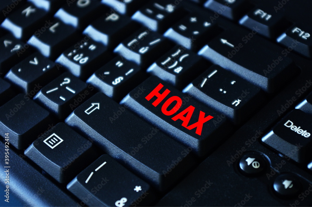 Hoax word on red keyboard button. Computer keyboard key with danger sign  with words Internet Hoax, Danger of Internet Hoax. Stock-Foto | Adobe Stock
