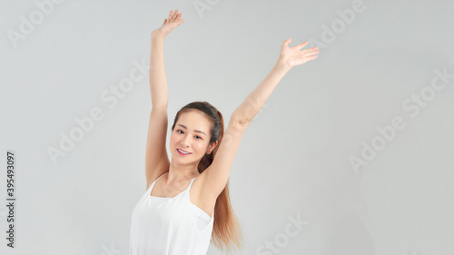 portrait of woman with hands up, isolated on white