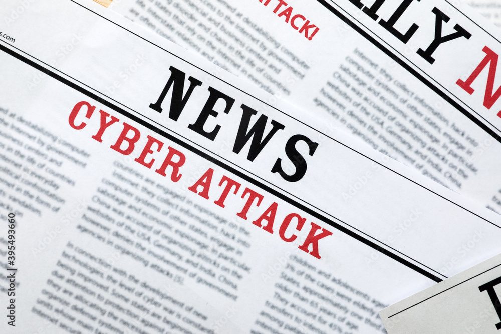 Obraz premium Newspapers with headlines Cyber Attack as background, closeup