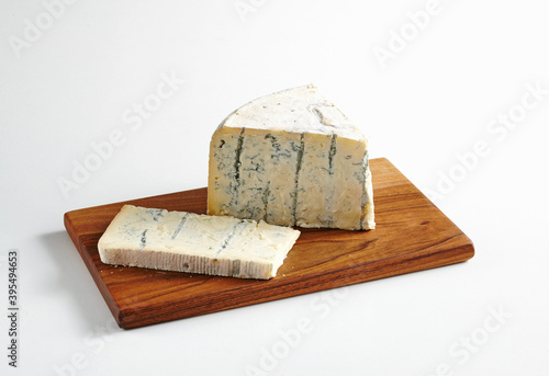 Gorgonzola with blue mold on a wooden board photo